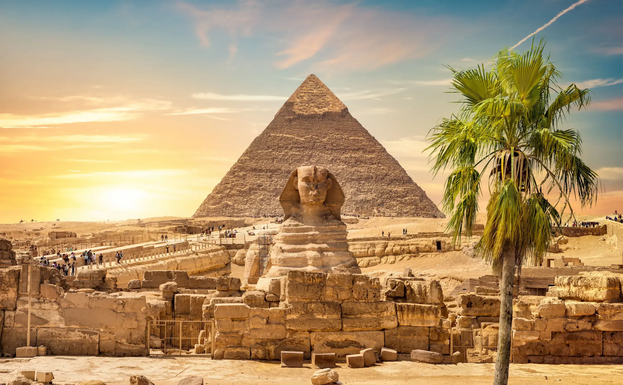 The Giza Pyramids and the Sphinx at sunset
